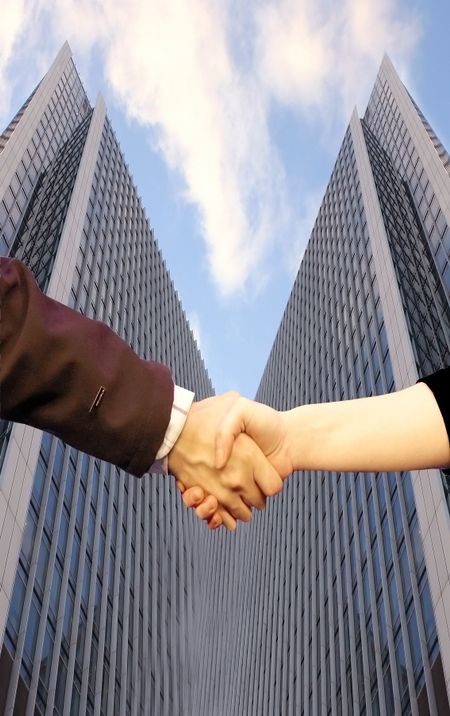 Sealing deal in front of corporate buildings