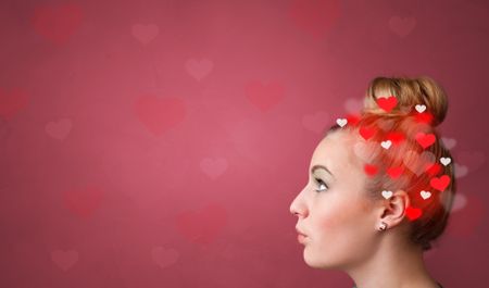 Head with full of love, red background and hearts