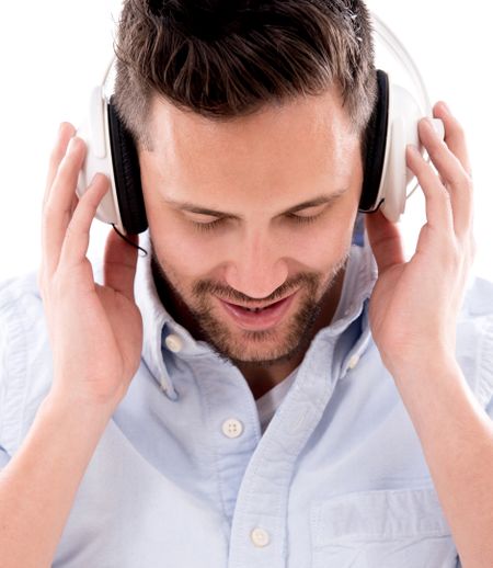 Man with headphones listening to music - isolated over white background