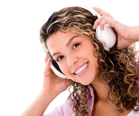 Happy woman with headphones listening to music - isolated over white