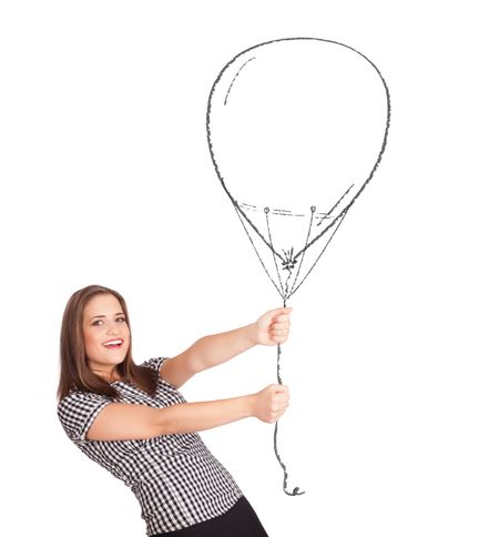 Pretty young woman holding balloon drawing