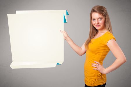 Baeutiful young woman holding white origami paper copy space