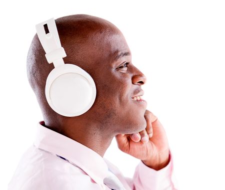 Business man with headphones listening to music - isolated over white background