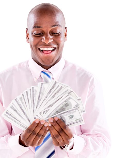 Successful business man holding dollar bills - isolated over white