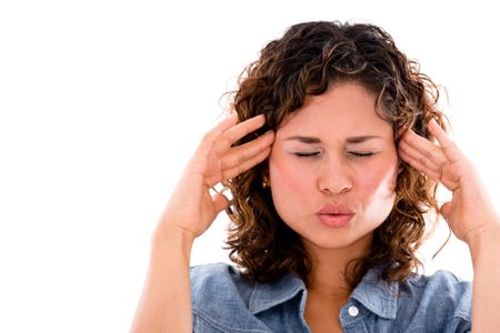 Frustrated woman with a headache - isolated over a white background