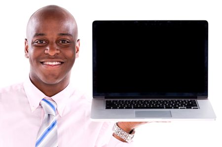Business man holding a computer and showing the screen - isolated over white 