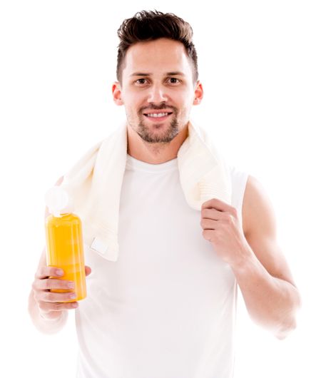 Happy gym man drinking water after workout - isolated over white 