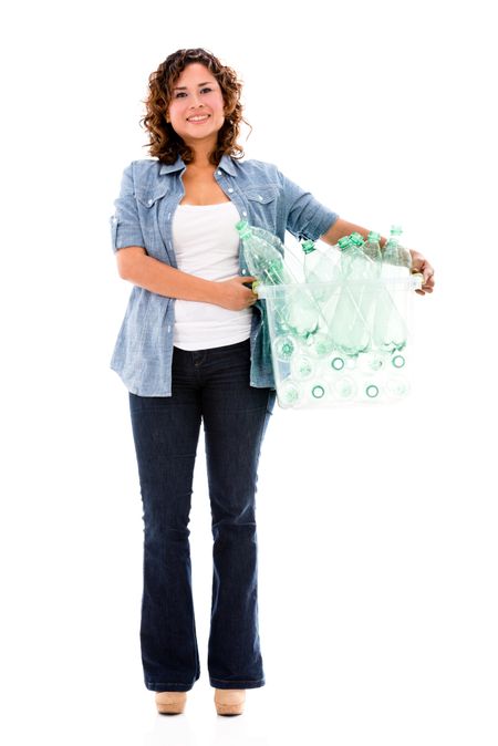 Happy woman recycling plastic bottles - isolated over white 