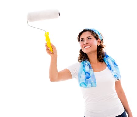 Woman painting with a paint roller - isolated over white background 