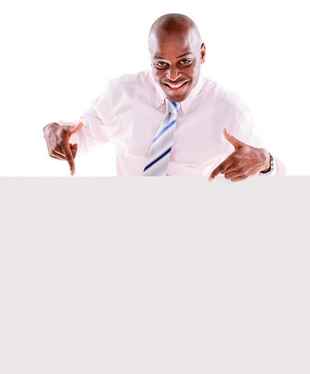 Happy business man pointing at a banner - isolated over white background 
