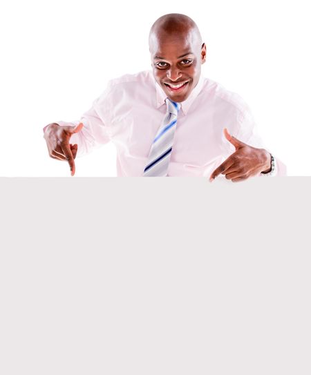 Happy business man pointing at a banner - isolated over white background