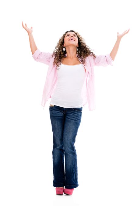 Excited woman standing with arms open - isolated over white