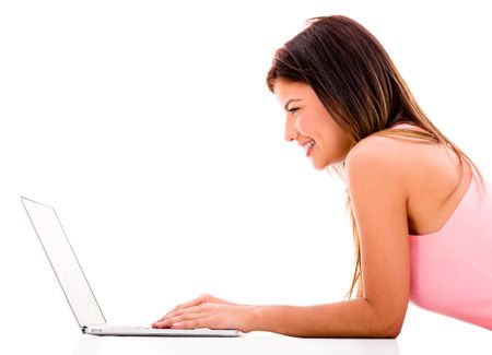 Woman working on a laptop computer - isolated over white background