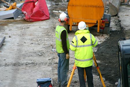 Builders discussing procedures
