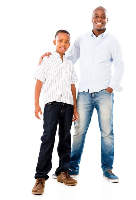 Portrait of a happy father and son smiling - isolated over white