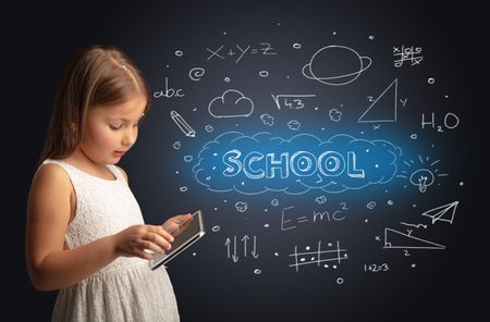 Adorable girl using tablet with educational concept