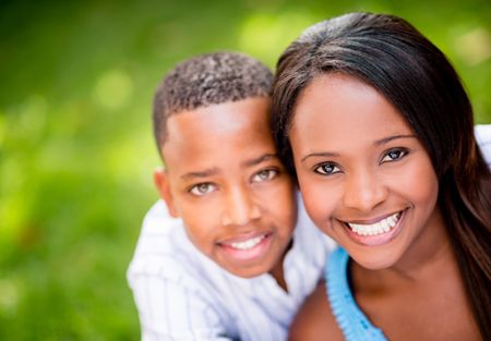 Beautiful portrait of a happy mother and son at the park