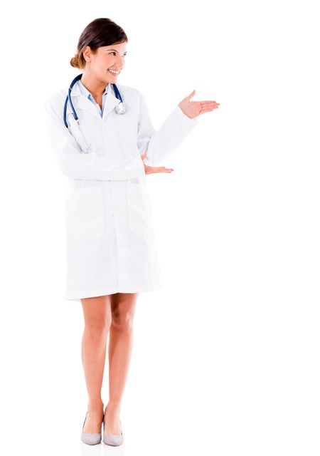 Female doctor presenting something with her hands - isolated over white 