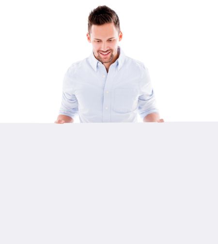 Man holding a mockup to edit and smiling - isolated over white background