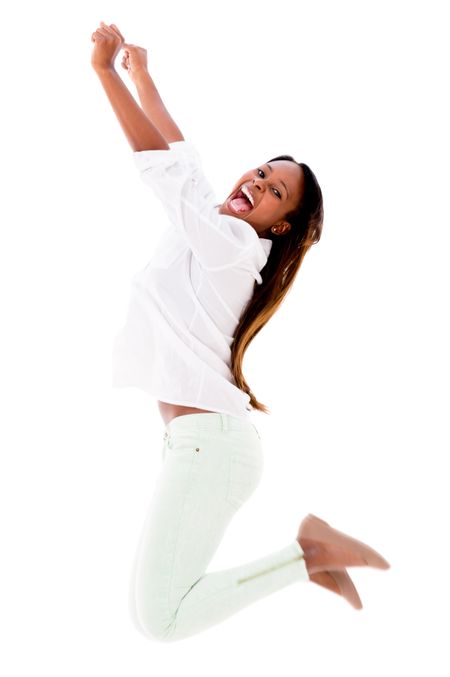 Happy woman jumping with arms up - isolated over a white background