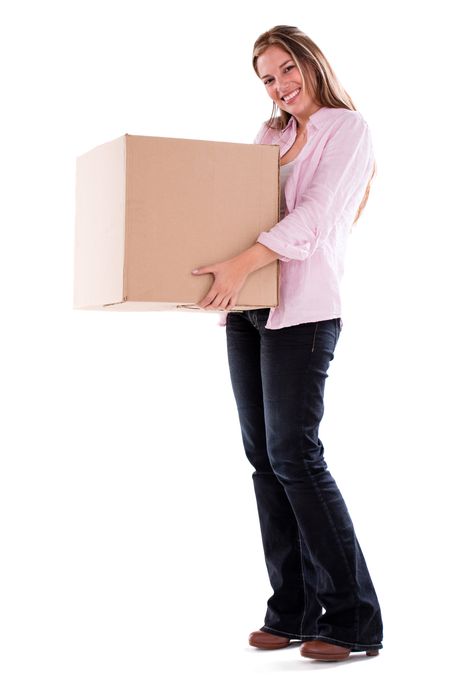 Happy woman moving and holding a box - isolated over white