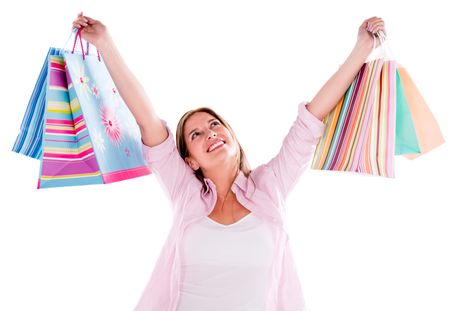 Happy shopping woman with arms up - isolated over white background 