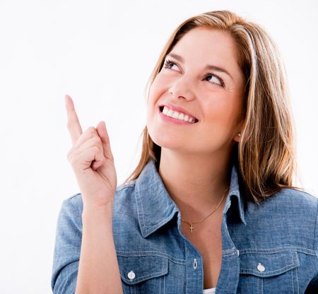 Thoughtful woman pointing and idea - isolated over white background 