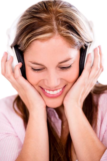 Happy woman with headphones listening to music - isolated over white 