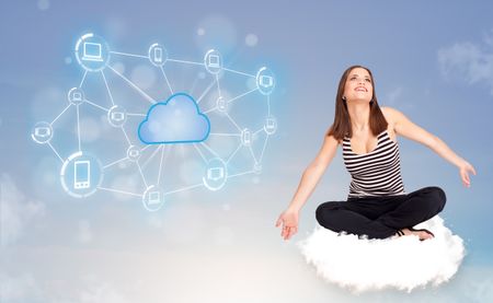 Happy young woman sitting on cloud with cloud computing