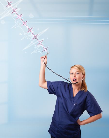 Pretty young medical doktor listening to red pulse and heart rates