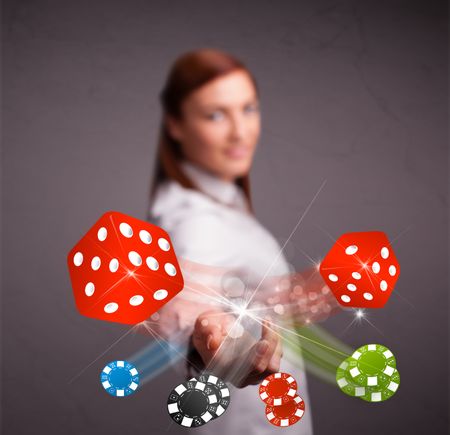 Pretty young woman throwing dices and chips