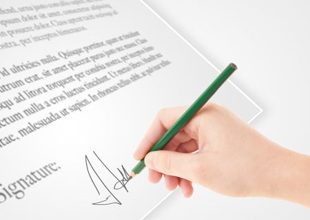 Hand writing personal signature on a legal paper