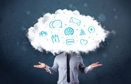 Man in suit with cloud head and blue icons on grungy background