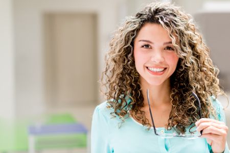 Successful business woman looking happy at the office 