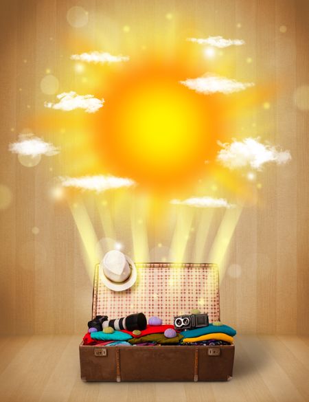 Summer bright sun with clouds and tourist bag and grungy background