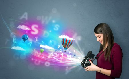 Cute photographer girl with camera and abstract imaginary