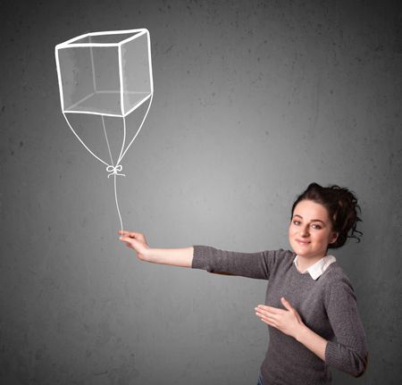 Pretty young woman holding a drawn cube balloon