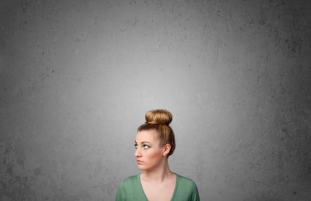 Pretty young woman gesturing with empty space