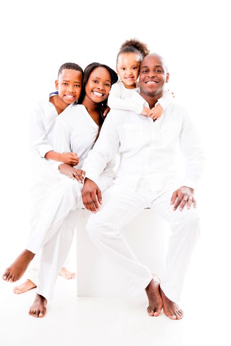 Happy family smiling together - isolated over a white background