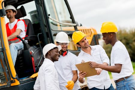 Group of engineers working at a construction site 