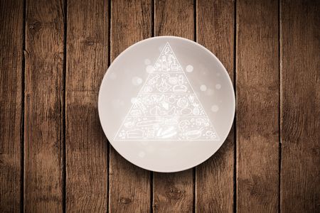Hand drawn food pyramid on colorful dish plate and grungy background