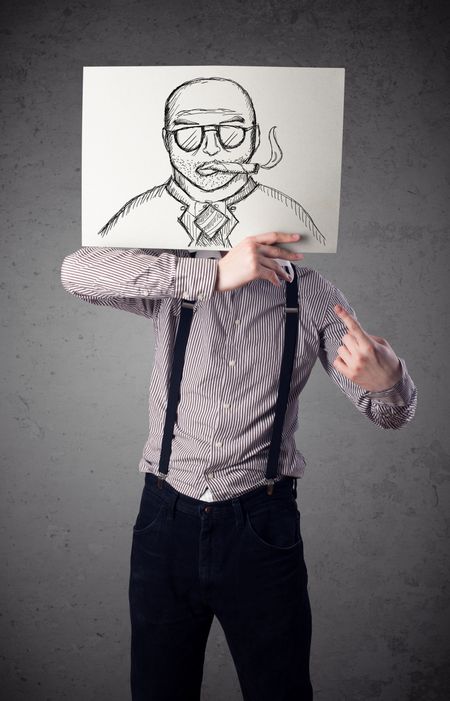Businessman holding a cardboard with a smoking man on it in front of his head