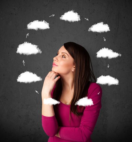 Thoughtful young woman with drawn clouds circulating around her head