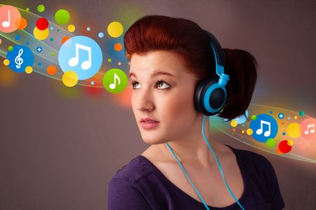 Pretty young woman with headphones listening to music, bubbles concept