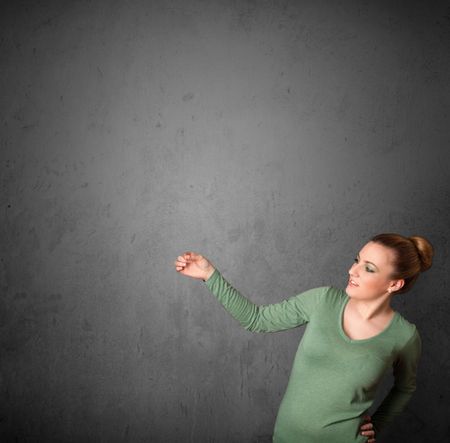 Young woman gesturing with empty space