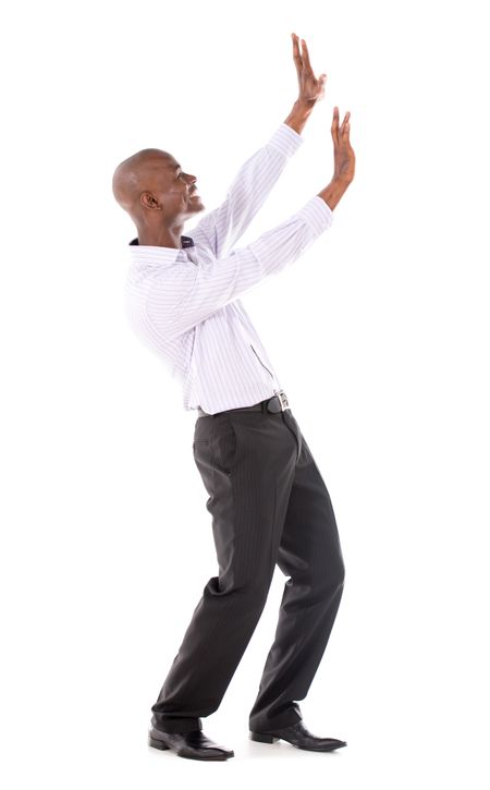 Business man pushing imaginary object with hands - isolated over white 