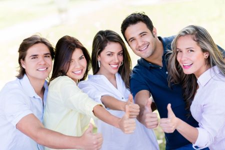 happy-group-friends-thumbs-outdoors-151033601 Happy group of friends with thumbs up outdoors