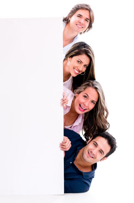 Happy group of casual people with a banner - isolated over white background 