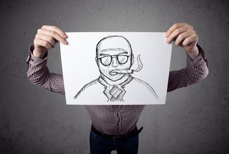 Businessman holding a cardboard with a smoking man on it in front of his head