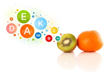 Healthy fruits with colorful vitamin symbols on white background